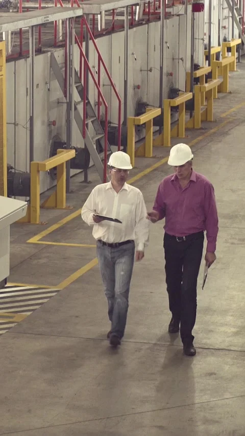 Engineers walking through factory Stock Footage 226538104