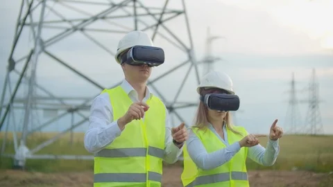 Engineers work with augmented reality using 3D virtual reality glasses. Female Vidéo 113403322