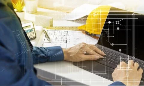 Engineers work on construction drawings and safety systems.,Building construc Stock Photos