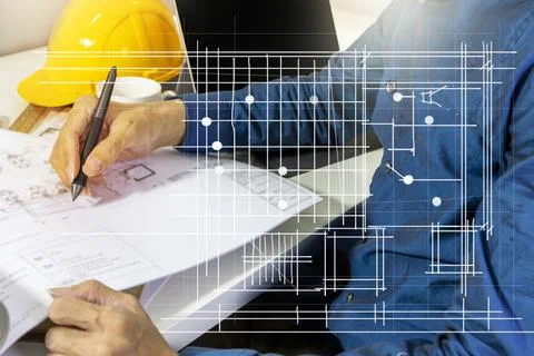 Engineers work on construction drawings and safety systems.,Building construc Stock Photos