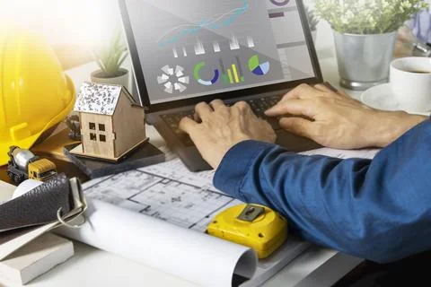 Engineers work on construction drawings and safety systems.,Building constr.. Stock Photos