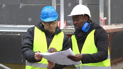 Engineers at work on construction site Stock Footage 102565425