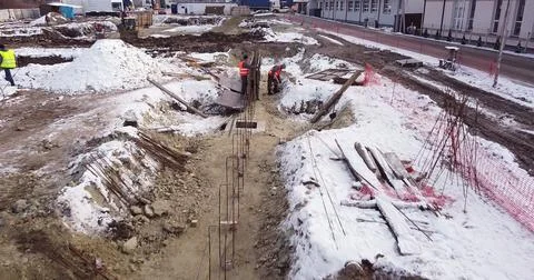 Engineers work with metal constructions while building a house. Aerial Flight Fotos de archivo