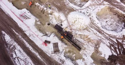 Engineers work with metal constructions while building a house. Aerial Flight Fotos de archivo