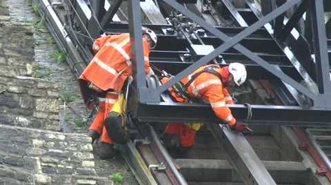 Engineers Working On Cable Cars Damaged In Cliffs Landslide Stock Footage 63316548