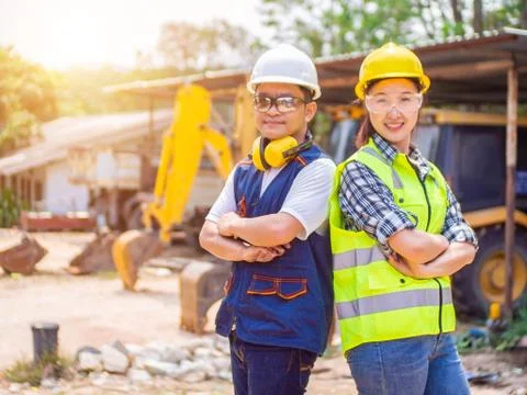 Engineers working in construction site.  Man and woman working in an open-pit Stock Photos