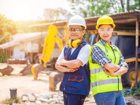 Engineers working in construction site.  Man and woman working in an open-pit Stock Photos