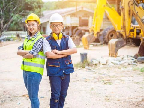 Engineers working in construction site.  Man and woman working in an open-pit Stock Photos