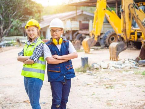 Engineers working in construction site.  Man and woman working in an open-pit Stock Photos