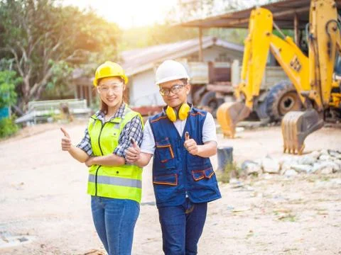 Engineers working in construction site.  Man and woman working in an open-pit Stock Photos