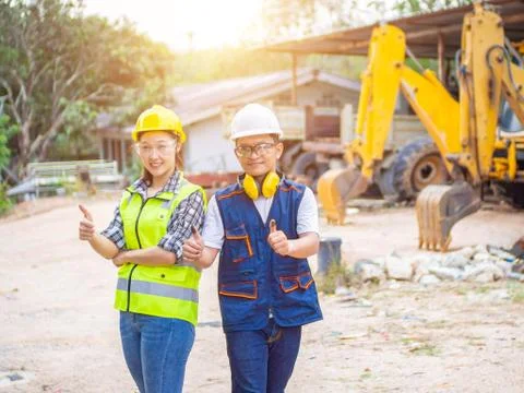 Engineers working in construction site.  Man and woman working in an open-pit Stock Photos