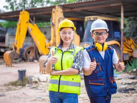 Engineers working in construction site.  Man and woman working in an open-pit Stock Photos