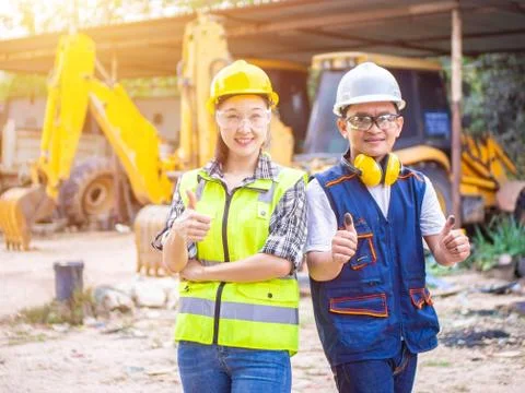 Engineers working in construction site.  Man and woman working in an open-pit Stock Photos