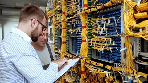 Engineers working in data room. Slow motion Stock Footage 65814711