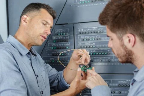 Engineers working with electronics components Foto stock