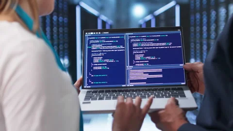 Engineers Working On Laptop Managing Servers Stock Footage 337226301