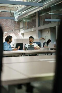 Engineers working on project in a tech modern company. Startup business group Stock Photos