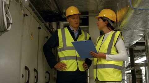Engineers working in temperature control room Stock-Footage 57647827