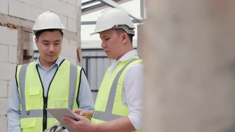 Engineers working through construction site. Stock Footage 134251562