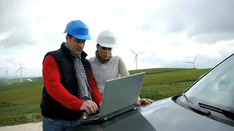 Engineers working by wind turbines field Stock-Footage 14824900