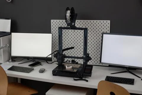 Engineers Workplace with 3D Printer and Computers Stock Photos