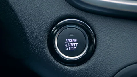 Engine's start button is getting pushed by a driver Stock Footage 101188316