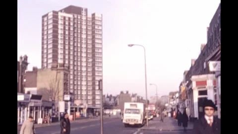 England 1970s, Intersection of road with street beside buildings Stock Footage 244081274