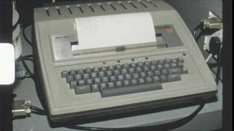 England 1970s, vintage computer printer and punched tape reader in control room Stock Footage 313108405
