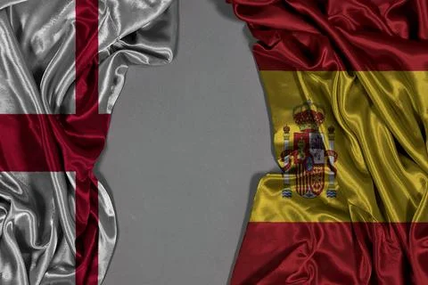 England and Spain two flags textile cloth, fabric texture 写真素材