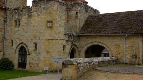 ENGLAND  CIRCA 2011: Fast pan past barns and rear entrance at Penshurst Place Video stock 99629425
