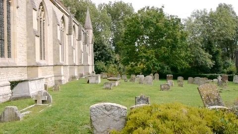 ENGLAND  CIRCA 2011: Grave yard at old english church. Stock Footage 99624800