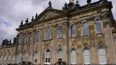ENGLAND  CIRCA 2011: Side view of Howard Castle with birds swarming around. Video stock 99619328