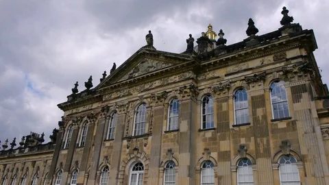 ENGLAND  CIRCA 2011: Side up view of Howard Castle with birds swarming around Stock Footage 99619398