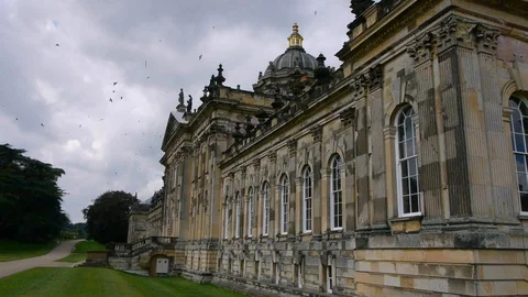 ENGLAND  CIRCA 2011: Side view Howard Castle with birds swarming around. Stock Footage 99619638