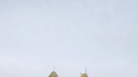 ENGLAND - CIRCA 2011: Tilt down to old english building in street Stock Footage 99635138