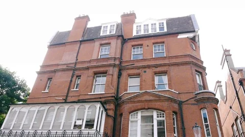 ENGLAND  CIRCA 2011: Tilt down Red brick apartments. Stock Footage 99642877