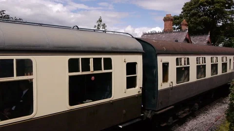 ENGLAND  CIRCA 2011: Train going through old english country train station. Stock Footage 99616641
