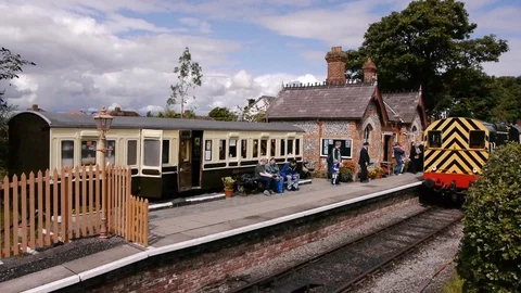 ENGLAND  CIRCA 2011: Train going through old english country train station. Stock Footage 99616780