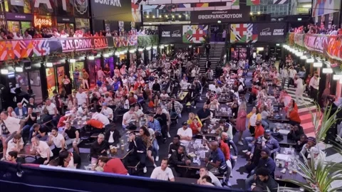 England fans at BoxPark Croydon react to Italy scoring Video stock 157070334