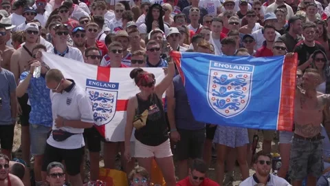 England fans react to third World Cup goal at Isle of Wight festival Stock Footage 149141616