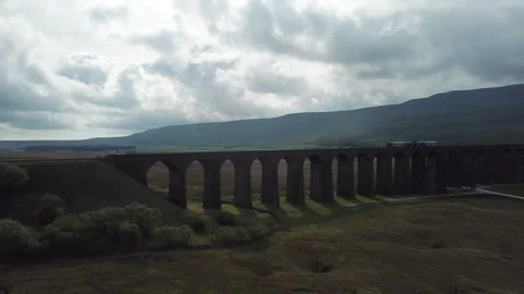 ENGLAND - OLD BRIDGE WITH TRAIN Stock Footage 203935914