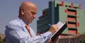 English Business Person Outside Office Building Looking Agenda Talk Smartphone 4k or 4k+ Resolution