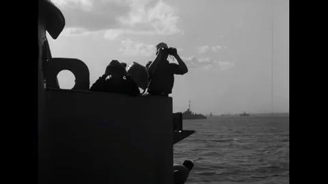 ENGLISH CHANNEL - 1944 - Crew on a tugboat look out over the English Channel off Stock Footage 341862753