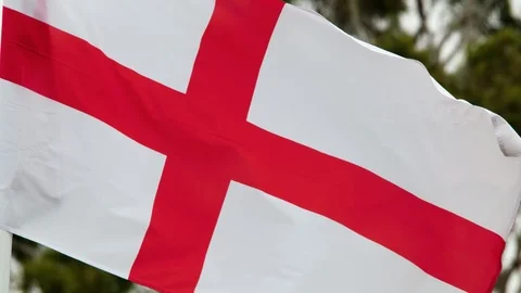 English flag also known as The Saint George's Cross, flying in the wind. Stock Footage 88303391