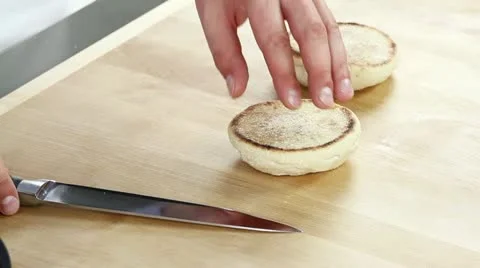English muffins being halved Stock Footage 24671599