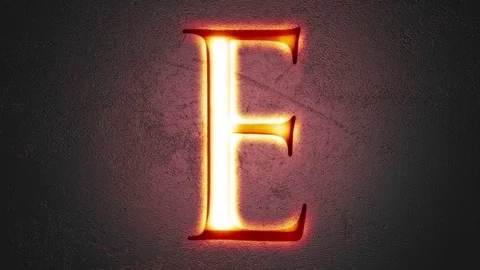 Engraved letter E shining on stone background, seamless looping Stock Footage 73662825