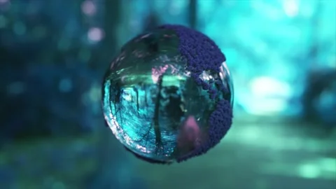 Engraved map of the world on a crystal ball. Rotating globe. Blurred forest Stock Footage 212597308