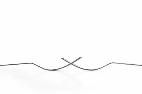 Engraved silverware fork set of two placed face to face crossing their teet.. Stock Photos