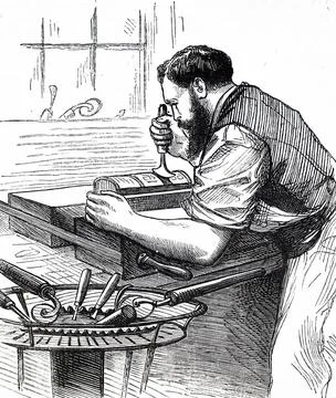  Engraving depicting a process in bookbinding: decorating the spine of a l... Stock Photos