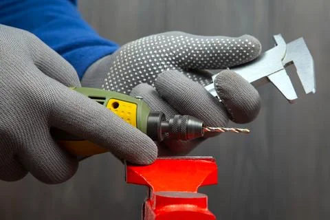 Engraving tool for cutting and processing metal and other objects in hand. .. Stock Photos
